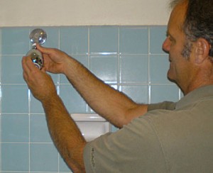 WaterConserve_Roy-installing-showerhead conserve times publishing group inc tpgonlinedaily.com