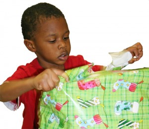 Boy opening gift SP Rzd